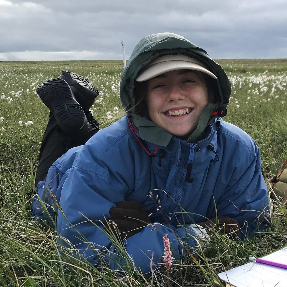 Becca smiles on the tundra.
